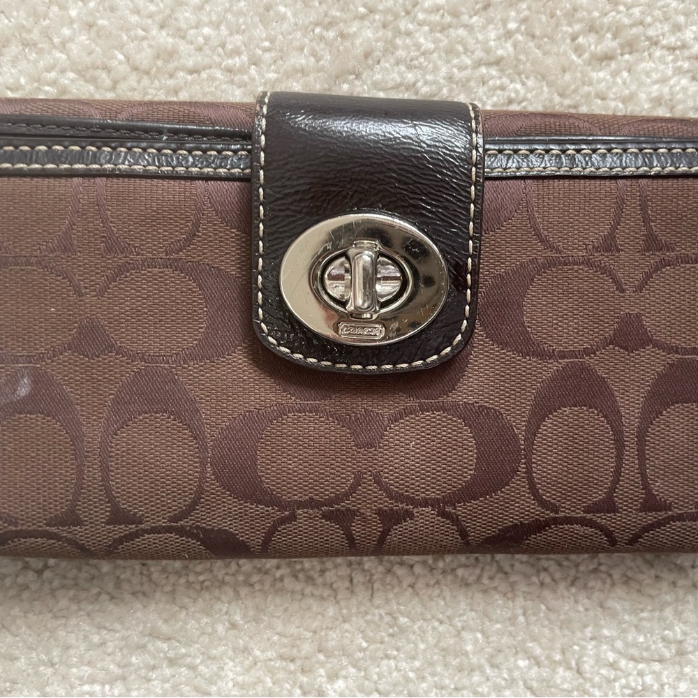 Brown coach wallet.